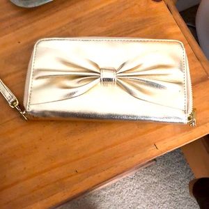 Gold wristlet never used!